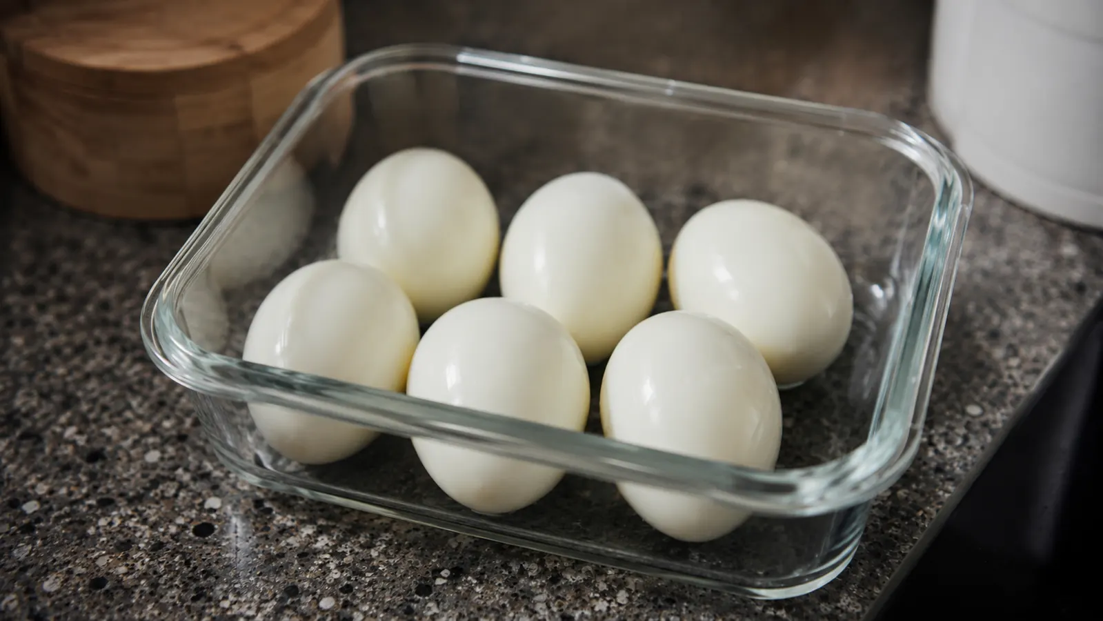 Peeled hard-boiled eggs in a glass meal-prep container ready for the week ahead